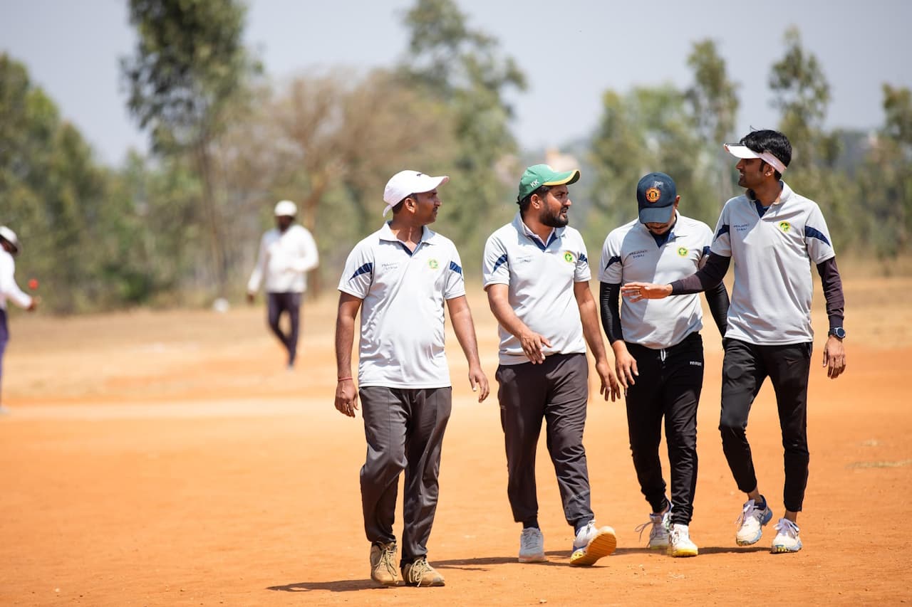 the cricketers walk across the field and choose a captain